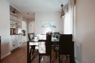 a dining room with a table and chairs at Stay & Play - Central Family Friendly in Calgary
