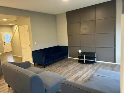 a living room with a couch and a table at Bedroom SW Edmonton HWY 2 near YEG in Edmonton