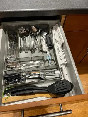 a drawer filled with utensils and utensils at Place near the Coquitlam River Park in Coquitlam