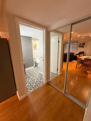 a view of a living room with a sliding glass door at Place near the Coquitlam River Park in Coquitlam