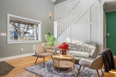 a living room with a couch and a table at Home Alone Retreat in Calgary