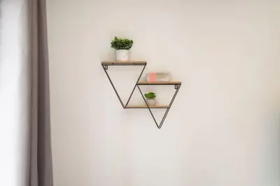 a shelf with two plants on a white wall at Northstar Whistler Village Resort in Whistler