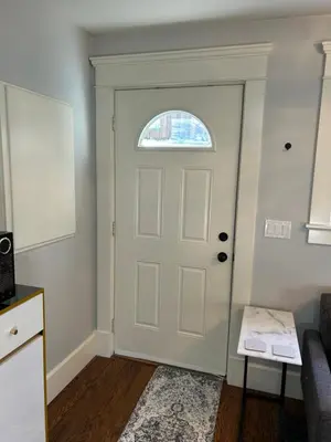 a white door in a room with a window at Garden Suite in Colwood in Victoria