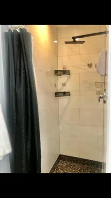 a bathroom with a shower with a shower curtain at Modern and luxury 3500 sq feet house jetted tub over 10000 sq feet lot in Edmonton