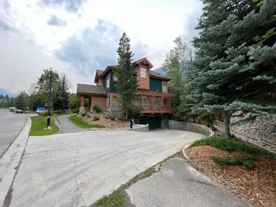 a house with a porch and a driveway at Riverbend Townhomes by StayIn in Panorama
