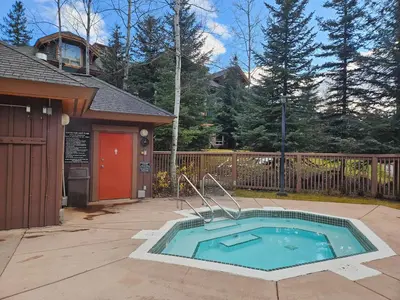 a swimming pool in a yard next to a house at Riverbend Townhomes by StayIn in Panorama