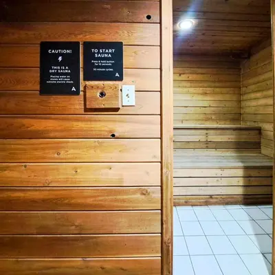 a sauna with two signs on a wall at Riverbend Townhomes by StayIn in Panorama