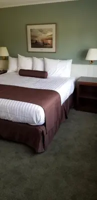 a hotel room with two beds in a room at Pacific Rim Motel in Ucluelet