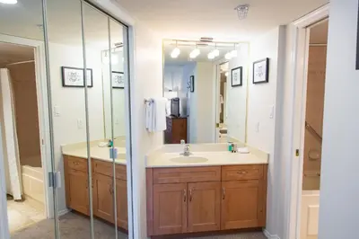 a bathroom with a sink and a mirror at 1BR next to slopes on Blackcomb w pool & hot tub in Whistler
