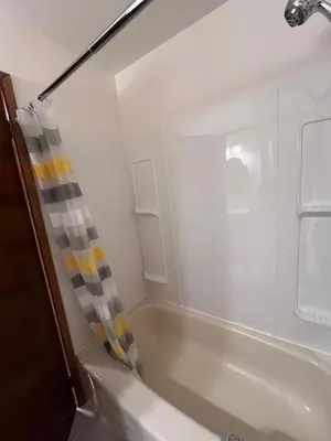 a bathroom with a tub and a shower at Peter's Place - Spacious 2Bed & Bath Suite in Surrey