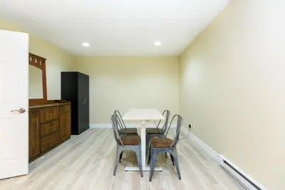 a dining room with a table and chairs at 2 BR Spacious Ground Level Suite in Victoria