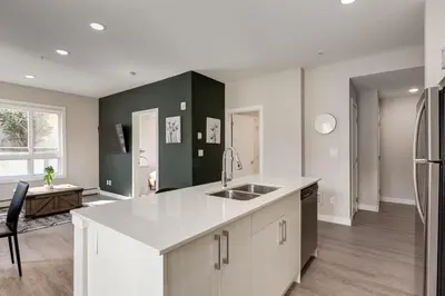 a kitchen with a sink and a counter top at Free Heated Parking, Close to DT, Pet Friendly in Calgary