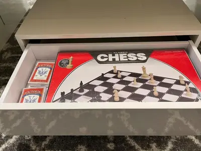 a chess game in a box on a table at Luxurious, Centrally Located Home in Cavanagh in Edmonton