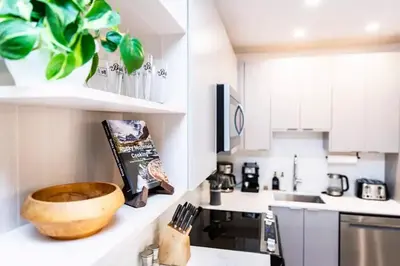 a kitchen with a wooden bowl on a counter at Lucid Lemming in Revelstoke