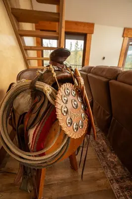 a purse sitting on a table next to a couch at River Safari Mountain View Suite in Blue River
