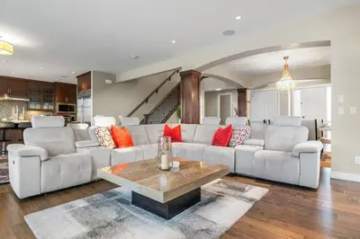 a living room with a couch and a table at Golden View Manor in Calgary