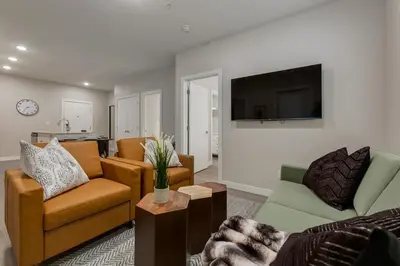 a living room with a couch and a tv at Free Parking, Pet Friendly, Close to DT in Calgary