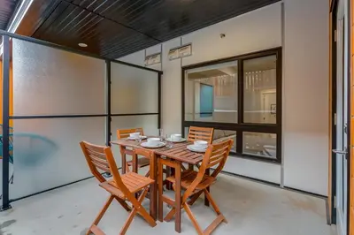 a dining room with a wooden table and chairs at Free Parking, Pet Friendly, Close to DT in Calgary