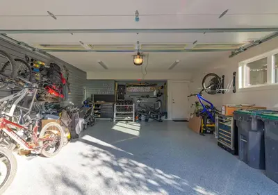 a garage with a bunch of motorcycles parked in it at Large Modern Home in Squamish in Squamish