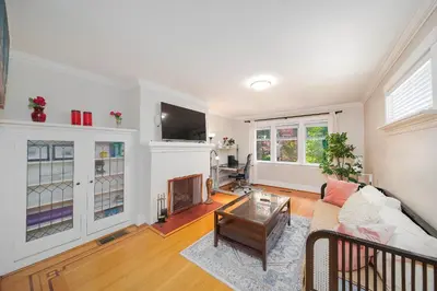 a living room with a couch and a tv at Charming 3BR Home Near UBC with Parking & Backyard in Vancouver
