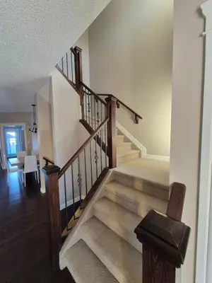 a staircase in a home with a stair case at Sean Comfy Home in Edmonton