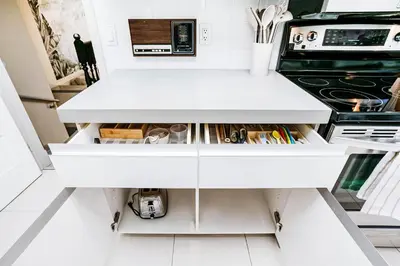 a kitchen with a white counter top and a stove at Chic Central 4BDRM Home-King Bed-AirHockey-Mins DT in Edmonton