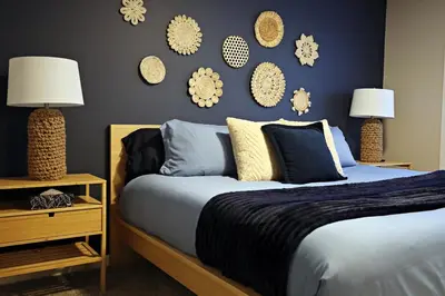a bedroom with a bed and some decorations on the wall at Edgemont Retreat, Groups, River Cree, WEM, Disney in Edmonton