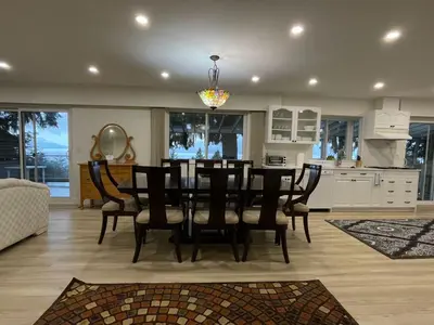 a dining room and kitchen with a table and chairs at Lionsbay in Lions Bay