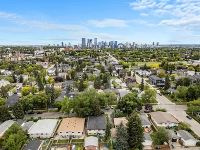 an aerial view of a residential neighborhood with a city skyline at Comfy, Cozy, Central Calgary, 2BR and 1BTH in Calgary