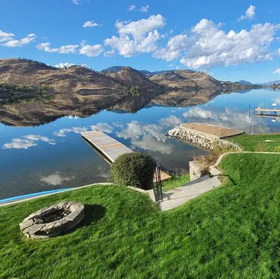 a view of a lake with mountains in the background at Skaha Lakefront Inn in Okanagan Falls