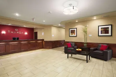 a lobby of a hotel with a waiting room at Ramada by Wyndham Edson in Edson