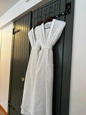 a white dress is hanging on a door at Amazing Views, Northern Lights, Stargazing Entire Guest Suite in Golden, BC Canada in Golden