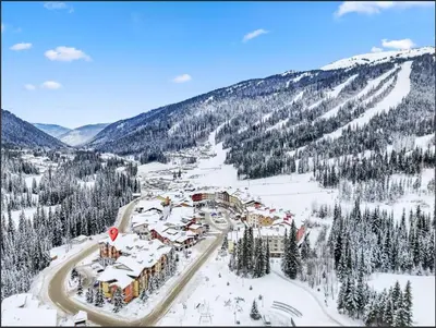 an aerial view of a ski resort in the snow at Main Village, Ski-in Ski-out, Hot Tub, Condo in Sun Peaks