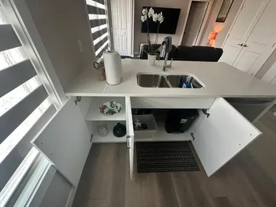 an overhead view of a kitchen with a sink at Cozzy & Brand New Apartment, Near Banff Hwy in Calgary