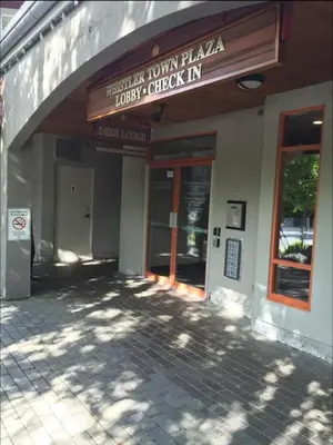 a building with a sign that reads town plazaucky check in at Beautiful 1BR in Village Centre in Whistler