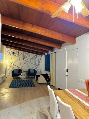 a living room with a bed and a table and chairs at P and N Suites in Edmonton