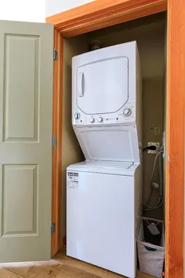 a microwave oven sitting on top of a refrigerator at Alpine at The Lodges of Canmore in Canmore