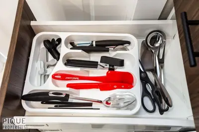 a drawer filled with utensils in a drawer at Park Life Escape-King Beds-Sleeps 10-Pet Friendly in Edmonton