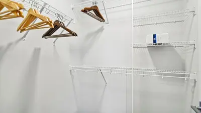 a room with white walls and white shelves at A Home away from Home in Calgary
