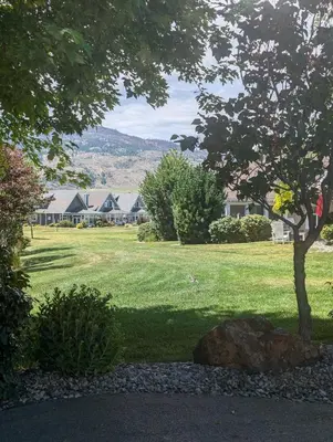 a park with houses and a tree and a rock at Sandy beach Sauvignon cottage - Osoyoos escapade 3bd-2bt in Osoyoos