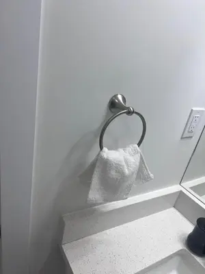 a towel handing on a towel rack in a bathroom at Midas Haven in Edmonton