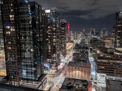 a city skyline at night with tall buildings at Breath Taking View for 4Guest DTskyline-22nd Floor in Calgary