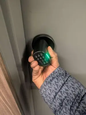 a person holding a remote control in their hand at Breath Taking View for 4Guest DTskyline-22nd Floor in Calgary
