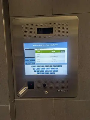 a computer screen on a wall with a remote control at Breath Taking View for 4Guest DTskyline-22nd Floor in Calgary