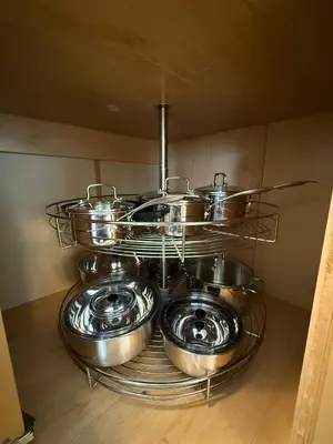 a bunch of pots and pans on a shelf in a kitchen at 2Bed Bright & Stylish Ritchie Urban Retreat in Edmonton