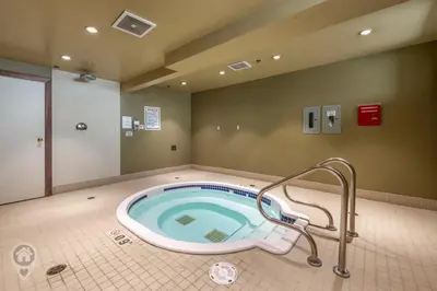 a jacuzzi tub in a bathroom with a shower at 901 Fernie by StayIn in Fernie