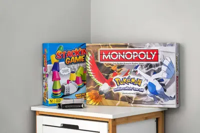 a box of shark game and a box of monopoly at Large Family 4BR w Kid's Play Den! FREE Banff Pass in Calgary