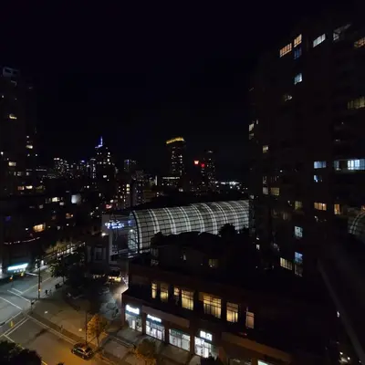 a view of a city at night with buildings at Charming Abode Downtown Vancouver in Vancouver