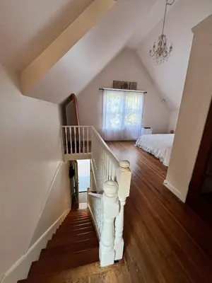 a attic room with a staircase and a bed at 3 level, home near downtown! in Vancouver