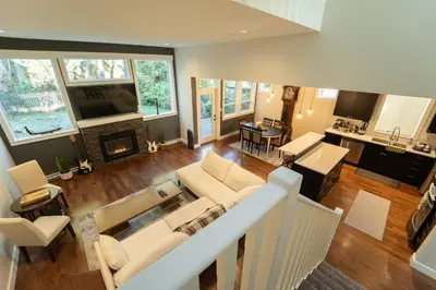an aerial view of a living room and dining room at Charming scape by Bear Mountain in Victoria